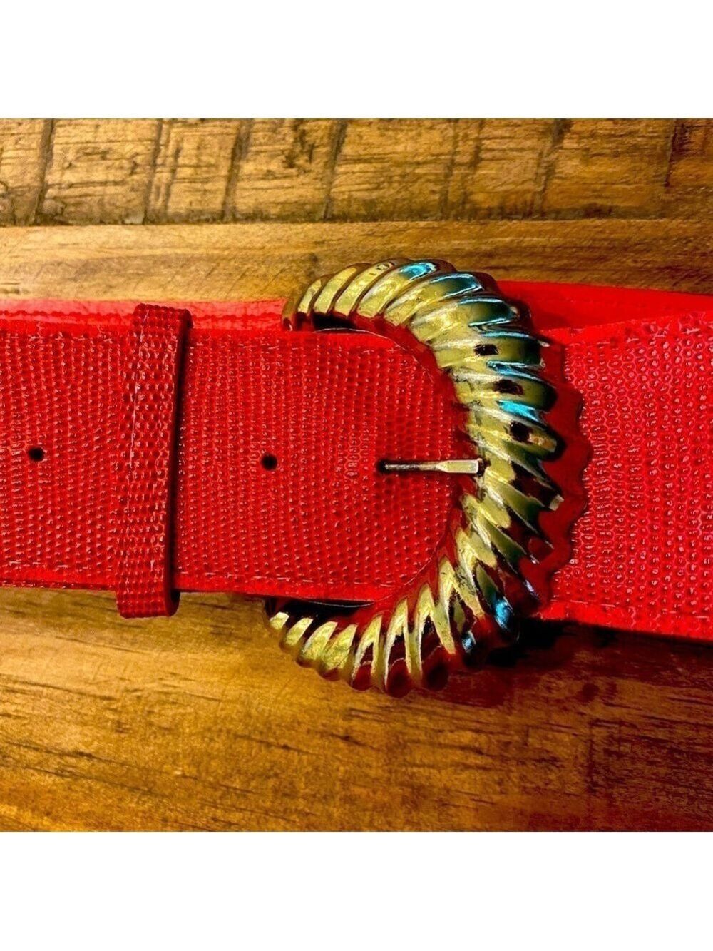 Red faux leather belt with gold tone buckle.  Make a bundle.  35.5” long